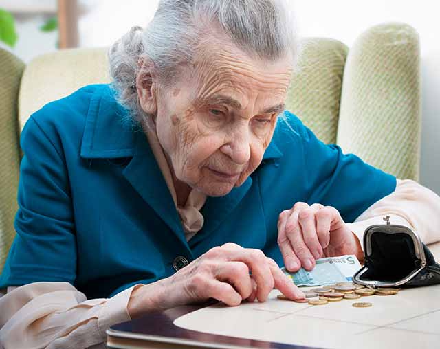Senior woman counting change