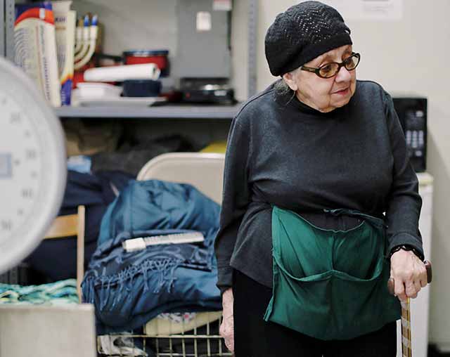 senior woman standing with cane